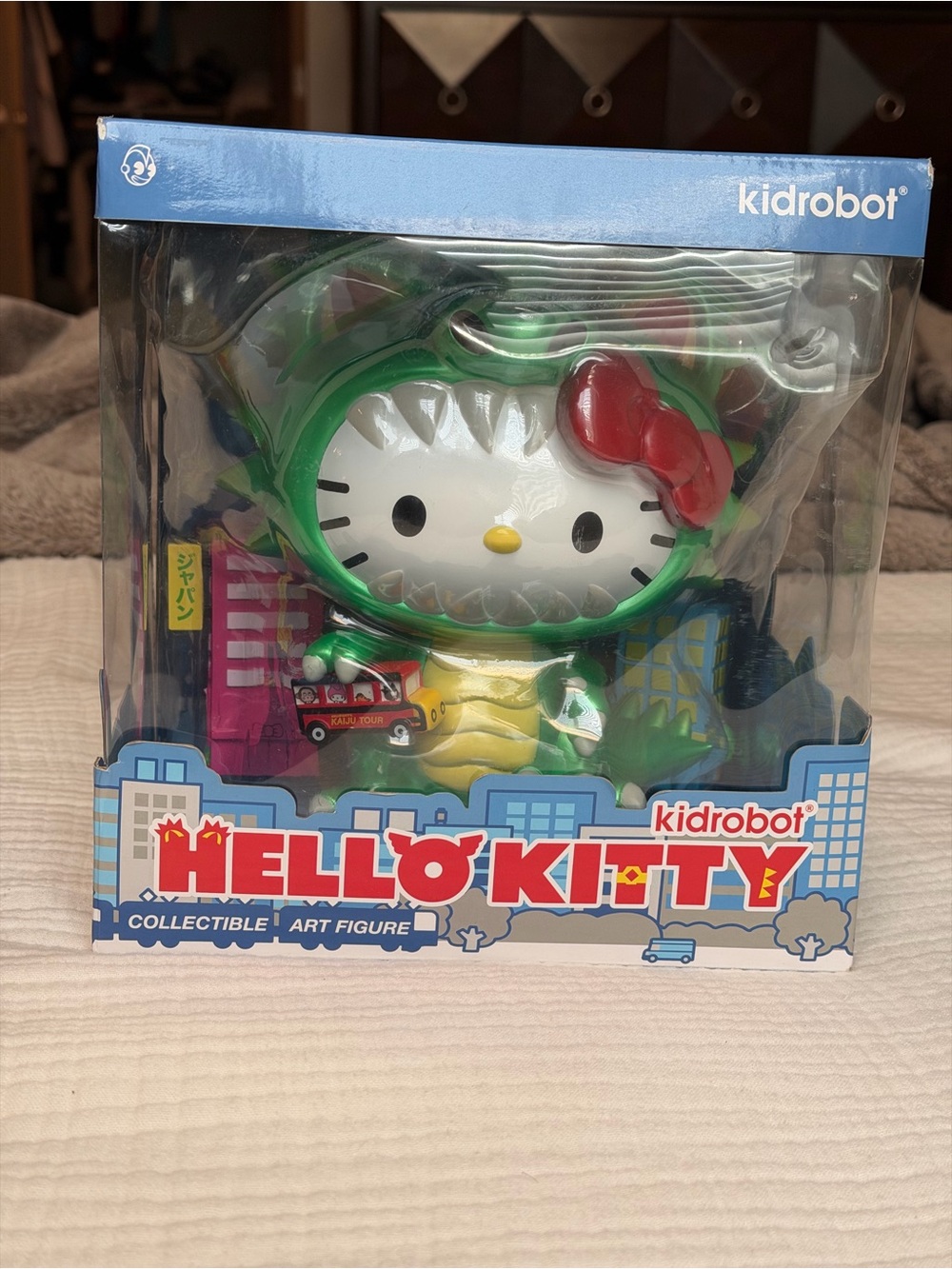 Hello Kitty Green Dinosaur Figure with Red Bow Kidrobot